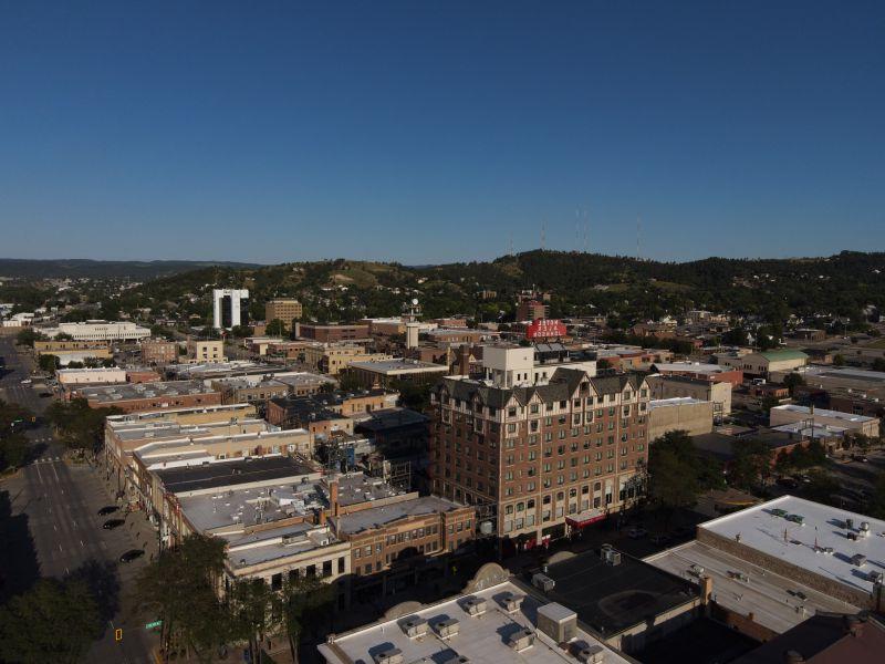 Aerial photo of downtown rapid city hotel alex johnson prominent in center